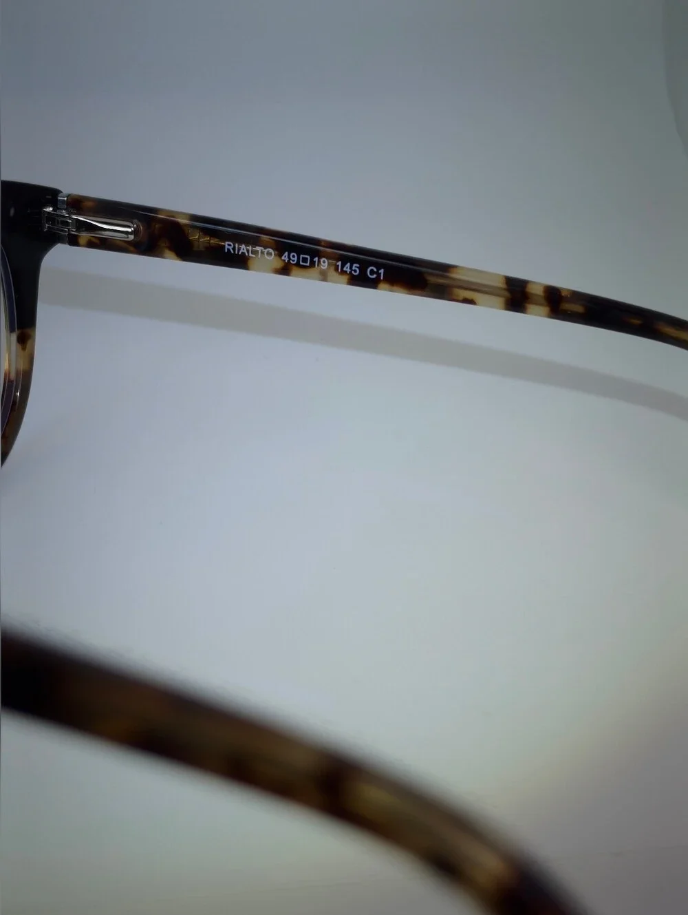 Rialto. Classic Round Black Upper, Animal Print Lower And Temples.